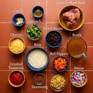Ingredients for ground beef and rice casserole: beef, rice, cheese, vegetables, beans, and seasonings labeled in bowls